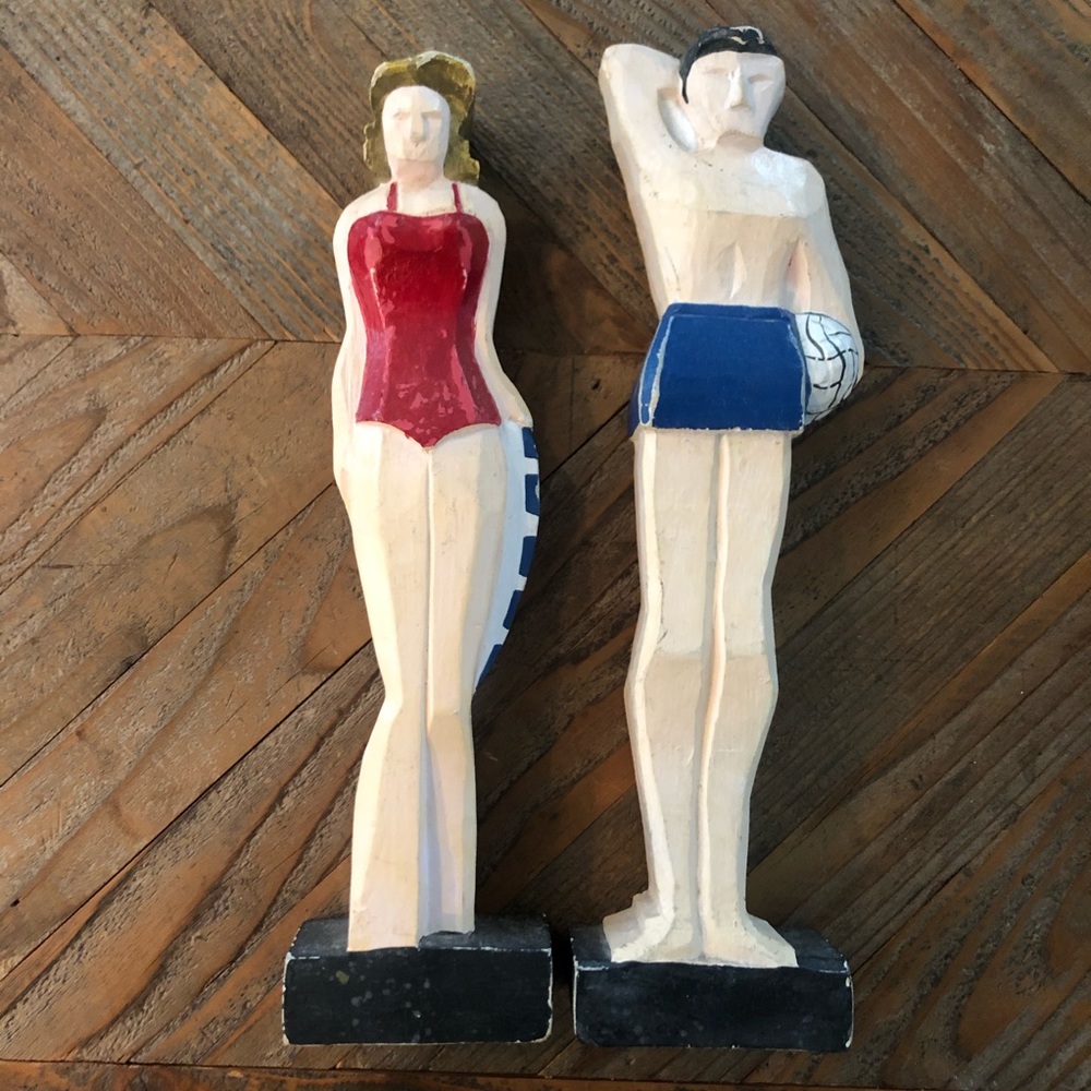 wooden man+woman volleyball statues